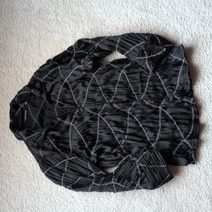 Cute silky and sheer zip top.